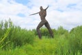 Willow sculpture of walking man