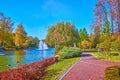 The willows and birches around the lake with fountains