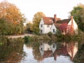 willy lotts cottage at flatford mill in suffolk in autumn reflections in lake Royalty Free Stock Photo