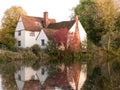 willy lotts cottage at flatford mill in suffolk in autumn reflections in lake Royalty Free Stock Photo