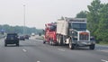 Wilmington, Delaware, U.S.A - June 29, 2023 - A tow vehicle carrying a large truck on Interstate 95 North