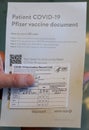 Wilmington, Delaware, U.S.A - March 25, 2021 - The Pfizer Covid-19 vaccine documents and patient`s card