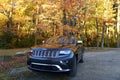 Wilmington, Delaware, U.S - November 3, 2018 - A silver Jeep Grand Cherokee with the golden fall foliage on the background