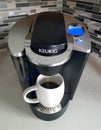 Wilmington, Delaware, U.S - September 10, 2020 - A Keurig coffee maker with a white mug