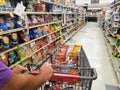 Wilmington, Delaware, U.S - September 7, 2021 - Pushing a cart on the snacks aisle inside a grocery shop