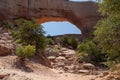 Wilson Arch, a natural sandstone arch located 24 miles south of Moab, Utah. Amazing view looking down into the valley Royalty Free Stock Photo