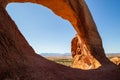 Wilson Arch, a natural sandstone arch located 24 miles south of Moab, Utah. Amazing view looking down into the valley Royalty Free Stock Photo