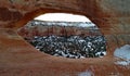 Sandstone arch with a snow background in Moab Utah