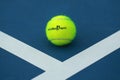 Wilson tennis ball with Australian Open logo on tennis court Royalty Free Stock Photo