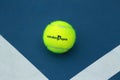 Wilson tennis ball with Australian Open logo on tennis court Royalty Free Stock Photo
