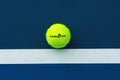 Wilson tennis ball with Australian Open logo on tennis court Royalty Free Stock Photo