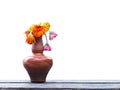 Wilted Gerbera in brown vase over white background Royalty Free Stock Photo