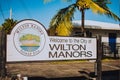 WILTON MANORS, FLORIDA - JAN 5, 2020: Sign That Says Welcome to the city of Wilton Manors With Palm Trees on an Island Graphic