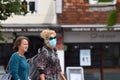 A woman wearing a face mask and matching sunglasses in public on the weekend that wearing face coverings became law in England