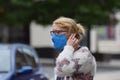 A woman in an English town centre wearing a face mask in public on the weekend that wearing face coverings became law in Englan