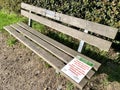 Wimbledon Common, London, 14th May 2020. Signs warning about non sanitised park benches during COVID-19 Pandemic.