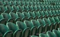 Rows of empty green spectators` chairs at Wimbledon All England Lawn Tennis Club. Royalty Free Stock Photo