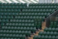Rows of empty green spectators` chairs at Wimbledon All England Lawn Tennis Club. Royalty Free Stock Photo