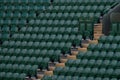 Rows of empty green spectators` chairs at Wimbledon All England Lawn Tennis Club. Royalty Free Stock Photo