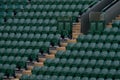 Rows of empty green spectators` chairs at Wimbledon All England Lawn Tennis Club. Royalty Free Stock Photo