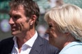 Retired player Pat Cash being interviewed by Sue Barker on centre court before the start of the men`s finals. Royalty Free Stock Photo