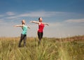 Wimen doing yoga outdoors nature shows poses photo