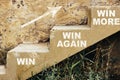 Win - Win Again - Win More painted on stairs. Victory concept. Royalty Free Stock Photo