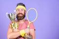 Win every tennis match i take part in. Tennis player win championship. Athlete hold tennis racket and golden goblet. Man Royalty Free Stock Photo