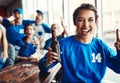 Win or lose, Ill always be devoted to the blues. Portrait of a woman holding up one finger while watching a sports game