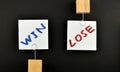 Win lose, two paper notes on black background Royalty Free Stock Photo
