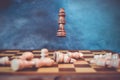 Win strategy concept with chess and surviving king among the fallen figures Royalty Free Stock Photo