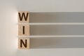 WIN word written on wood block. WIN text on light table for your desing, concept Royalty Free Stock Photo