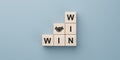 Win win wording with hand shaking icon on wooden cube block. win-win in business concept for success and business deal situation Royalty Free Stock Photo