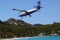 Winair plane landing at St Barts airport. Royalty Free Stock Photo