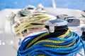 Winch with colourful yellow-blue rope on sailing boat Royalty Free Stock Photo