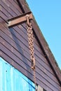 Winch hook on a harbour-side building.