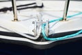 Winch and nautical ropes on a front of sailing boat in the port Royalty Free Stock Photo