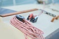 Winch and nautical ropes on a sailing boat in the port Royalty Free Stock Photo