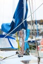 Winch and nautical ropes on a sailing boat in the port Royalty Free Stock Photo