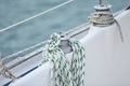 Winch and nautical ropes on a sailing boat in the port Royalty Free Stock Photo