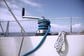 Winch with rope on a sail boat in the sea Royalty Free Stock Photo