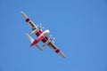 Winchester, CA USA - June 14, 2020: Cal Fire aircraft preparing to drop fire retardant on a wildfire from the sky near Winchester,