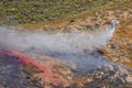 Winchester, CA USA - June 14, 2020: Cal Fire aircraft drops fire retardant on a dry hilltop wildfire near Winchester, California