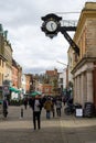 03/11/2020 Winchester, Hampshire, UK Winchester High street with shoppers walking past the old clock overhead