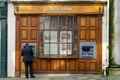 11/06/2019 Winchester, Hampshire, UK A man in a suit Using a cashpoint or ATM outside an old Lloyds bank