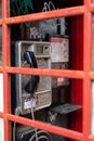 03/11/2020 Winchester, Hampshire, UK An old phone box shot through the broken glass of the red phone box after it was vandalised