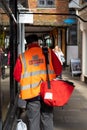 03/11/2020 Winchester, Hampshire, UK A Royal mail postman delivering mail in the street