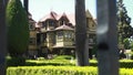 Winchester Mystery House Tourists Point to Iconic Front Building