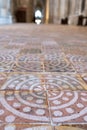 Winchester UK. Close up of the medieval encaustic floor tiles in the south isle of the retrochoir at Winchester Cathedral