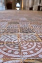 Winchester UK. Close up of the medieval encaustic floor tiles in the south isle of the retrochoir at Winchester Cathedral